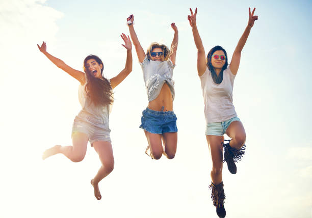 istock Three agile energetic teenagers leaping in the air 1019427340