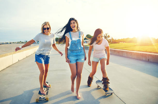 Three active young woman on a day at the seaside