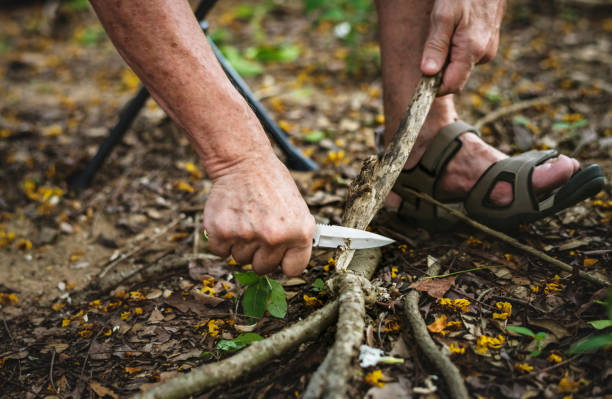istock Mature man cutting some firewood 1019438052