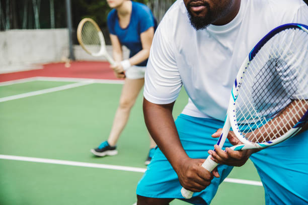 istock Couple playing tennis as a team 1019438388