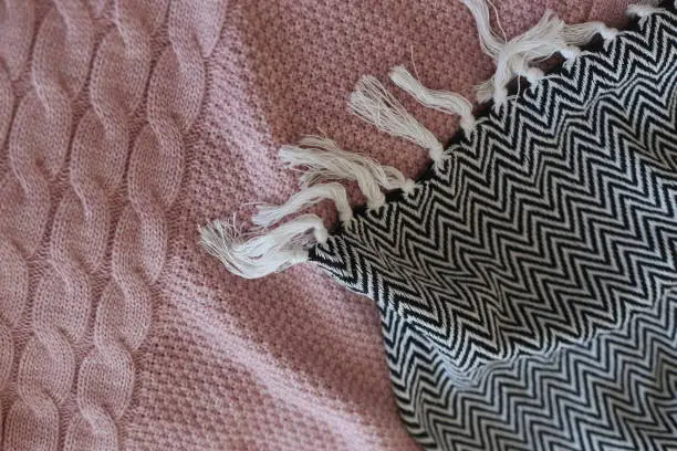 Photo of interior bedroom details textiles gray pink style