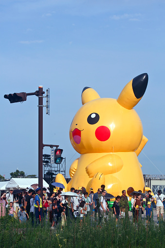 Yokohama, Kanagawa Prefecture, Japan - August 12, 2018: Giant inflatable Pikachu displayed near the Red Brick Warehouse during the 5th \