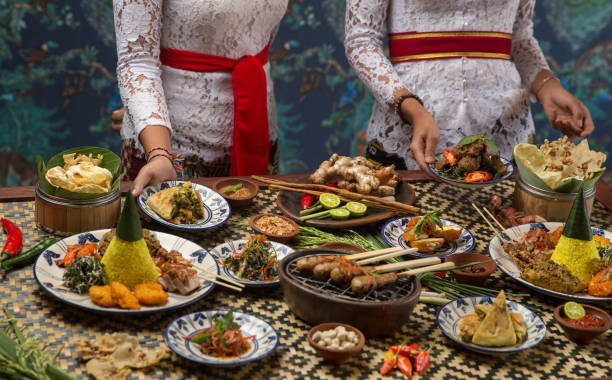 istock Waiter is serving table with different dishes. Waiter carrying plates with on some festive event, party or wedding reception 1019442090