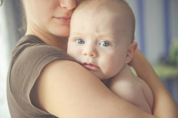 istock Mom hugs a newborn baby 1019452742