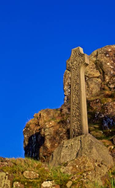 istock Celtic Cross on Hill in a Graveyard in Scotland 1019452826