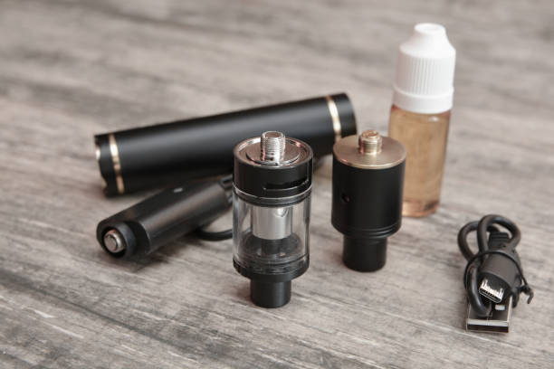 istock E - cigarette for vaping , technical devices.The liquid in the bottle 1019456844