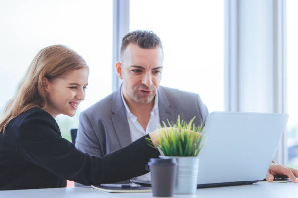 istock Team are working together analyzing business data on laptop 1019461040