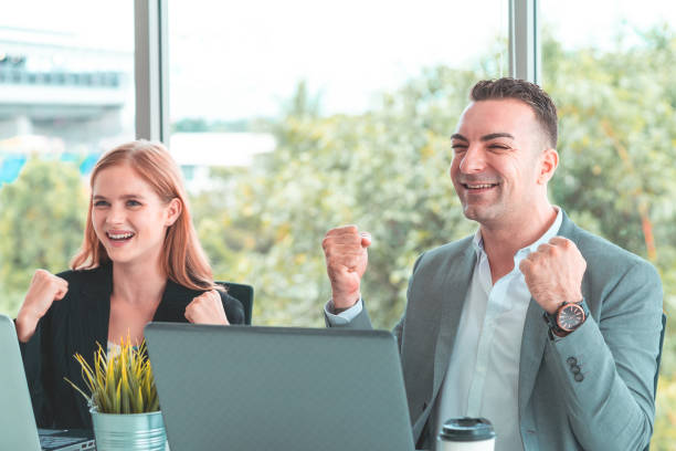 istock Success Business Couple is celebrating work together 1019461076