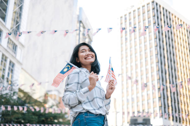istock Women celebrate Malaysia Independence Day 1019464436