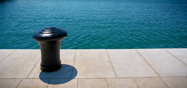 The steel bollard in a harbor quay