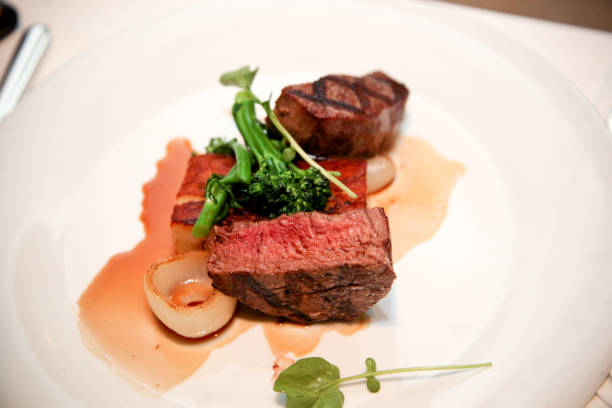 istock grilled steak with herbs on a white plate 1019467428