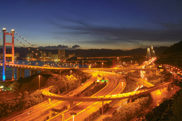 istock the highway bridge at day in hong kong at night 1019468314