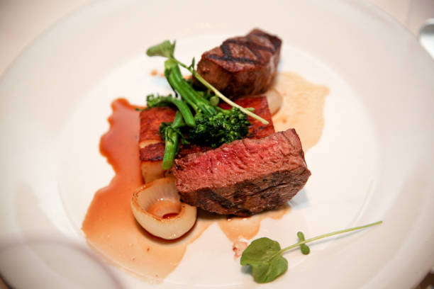 istock medium rare steak with rosemary 1019468838