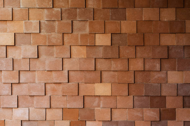 istock Abstract pattern of decorative stone brick wall surface with cement textured red color background 1019474050
