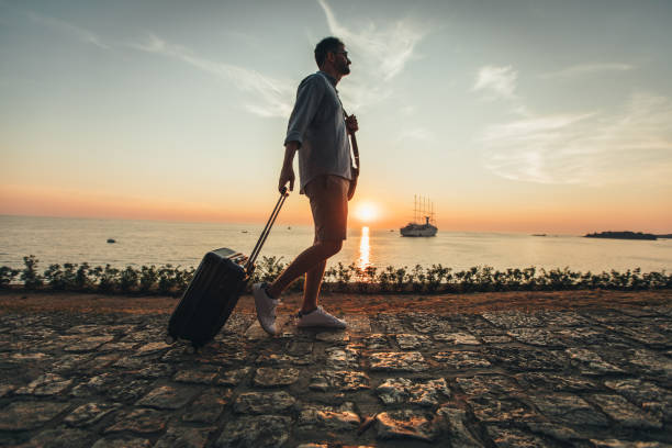 istock Walking by the sea in sunset 1019481170