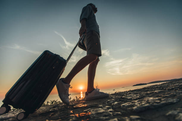 istock Man walking by the sea 1019482532