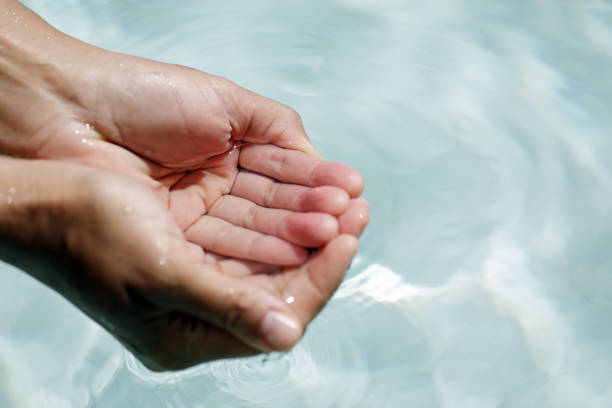 istock Clear water in woman hands 1019494872