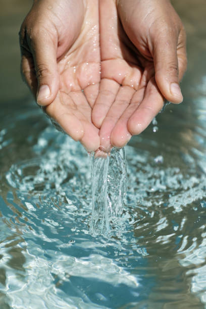 istock Clear water in woman hands 1019496622