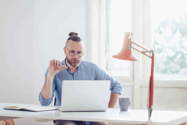 istock Young businessman working on laptop. 1019500352