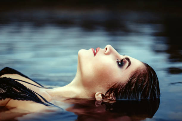 istock face girl lying in the water 1019504680