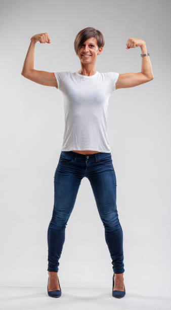 istock Muscular fit woman flexing her muscles 1019505490