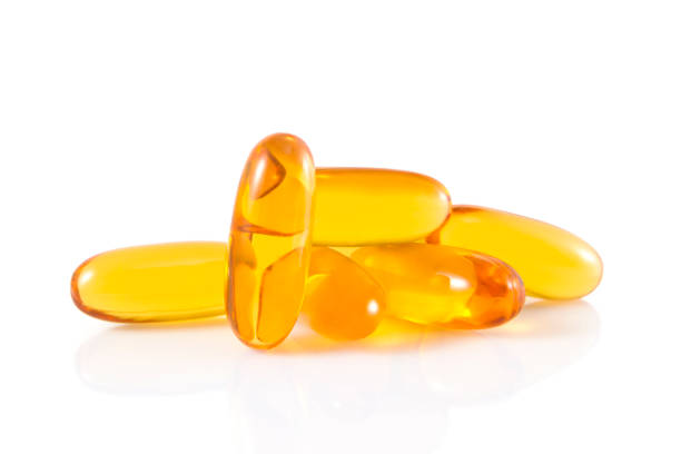 капсулы - vitamin e capsule vitamin pill cod liver oil стоковые фото и изображения