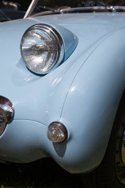 istock headlamp on heritage, classic car, UK 1019534684