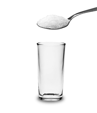 Pouring powder on water glass on  background