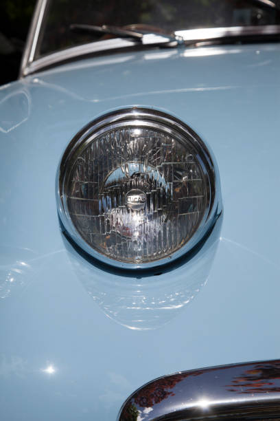 istock headlamp on heritage, classic car, UK 1019535602