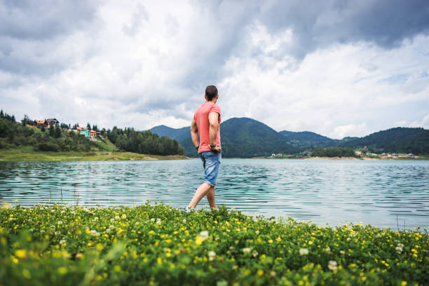 istock One man standing alone on Zaovine lake and looks forward 1019537966