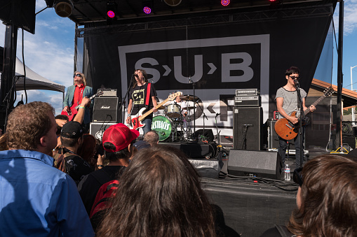 Seattle, USA - Aug 11, 2018: A Crowd watching the band Fastbacks at the SPF30 SUB POP party on the Beach in West Seattle late in the day.