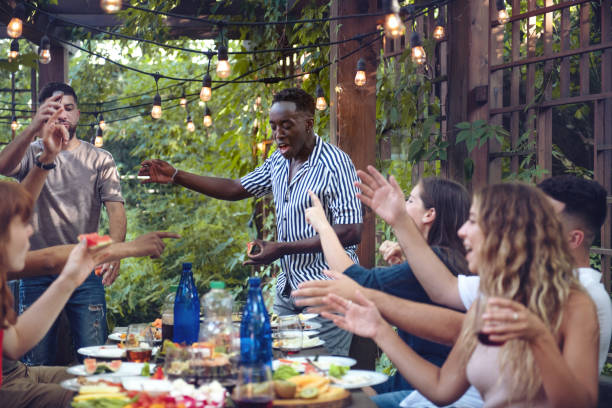 istock Multi-ethnic friends enjoying dinner together 1019538972