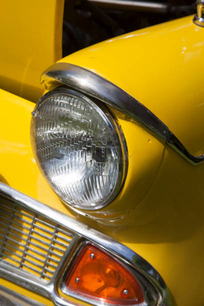 istock headlamp on heritage, classic car, UK 1019539278