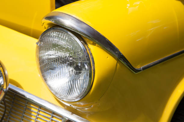 istock headlamp on heritage, classic car, UK 1019539468