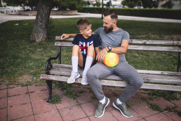 istock Father and son taking a break from football 1019539624