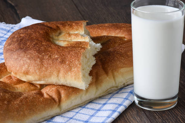 stile rustico. pane e latte in un bicchiere - milk bread foto e immagini stock