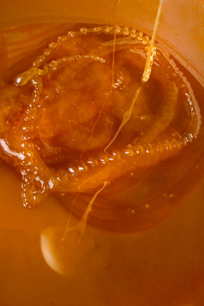 istock honey liquid background macro closeup. Helth food 1019545114