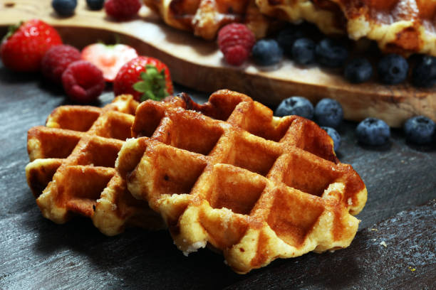 istock Traditional belgian waffles with fresh mint, sugar and raspberries. 1019547792