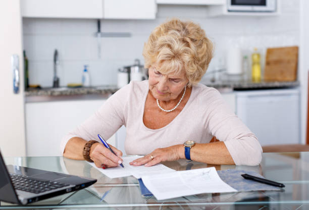 istock Woman filling up documents 1019547874