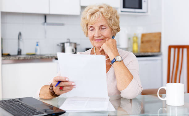 istock Woman filling up documents 1019547898