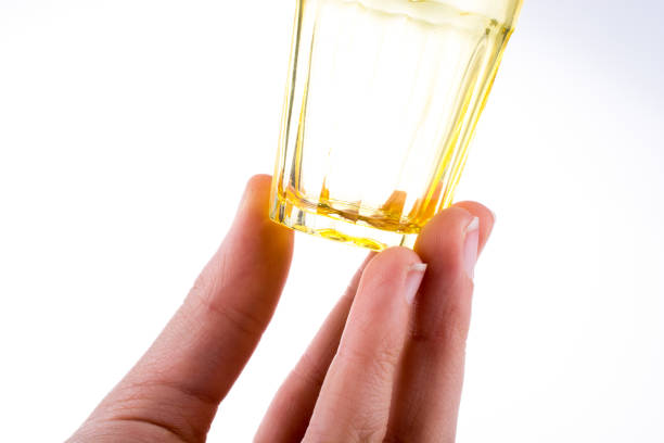 istock Colorful empty drinking glass in hand 1019548798