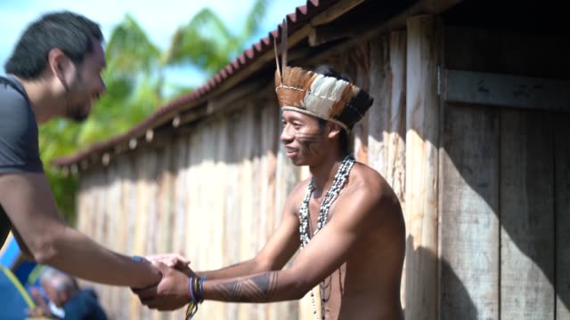 Native Brazilian Welcoming the tourist on Brazilian Indigenous Tribe, from Guarani ethnicity