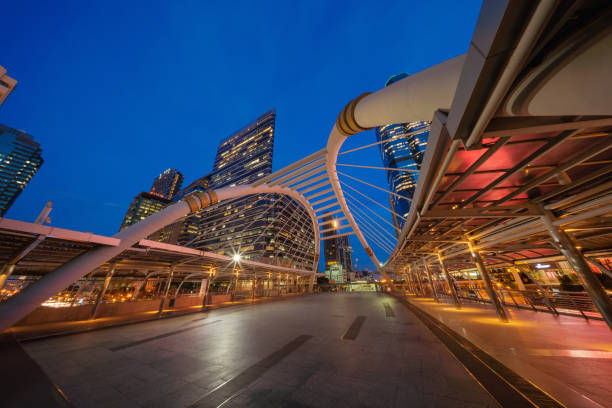 istock Chong Nonsi Bridge. Architectures in smart city for technology background. Skyscraper buildings in Bangkok City at night, Thailand 1019553784