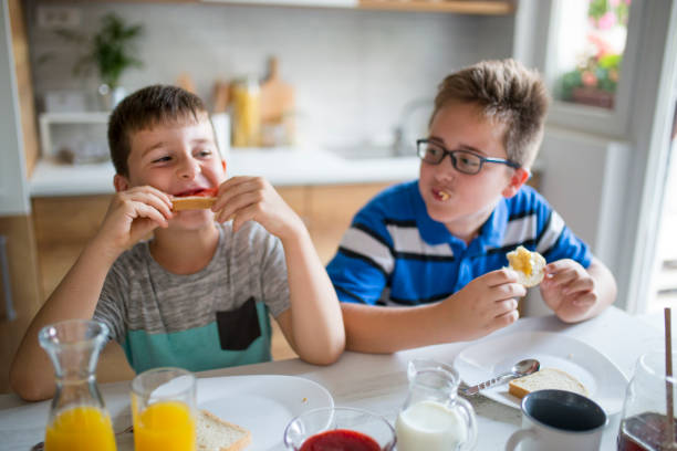 istock Happy kids having healthy breakfast 1019557618
