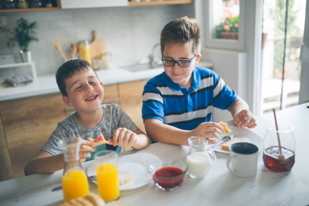 istock Happy kids having healthy breakfast 1019557664