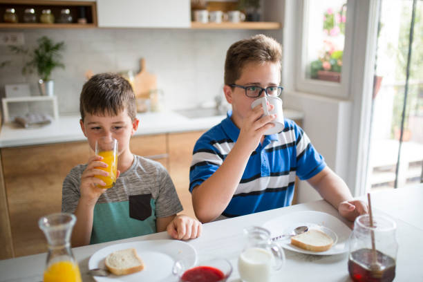 istock Happy kids having healthy breakfast 1019562282