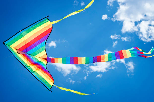 istock colorful flying kite flying in the sky 1019562312