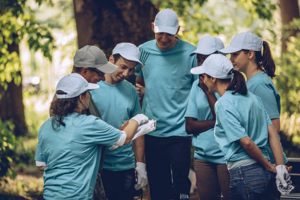 istock Volunteers organizing in park 1019562800