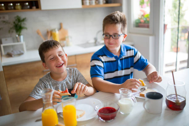 istock Happy kids having healthy breakfast 1019565132