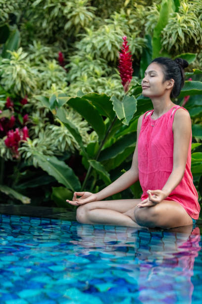 istock Beautiful asian woman practicing yoga 1019565240